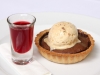 Warm Chocolate Tart with Raspberry Consume & Pistachio Ice Cream